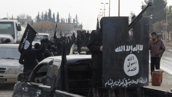 Fighters of al-Qaeda linked Islamic State of Iraq and the Levant parade at the Syrian town of Tel Abyad