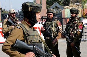 Indian army soldiers stand guard outside an army camp after suspected militants attacked the camp, in Jammu