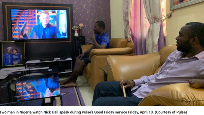 Two men in Nigeria watch Nick Hall speak during Pulse’s Good Friday service Friday, April 10