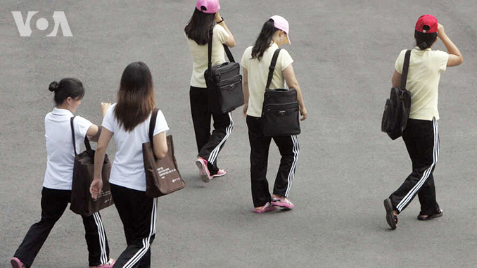 Women who have escaped from North Korea walk to their class at the Hanawon centre in Anseong