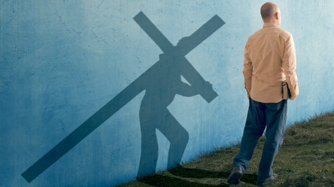 man-carrying-cross-true-disciple