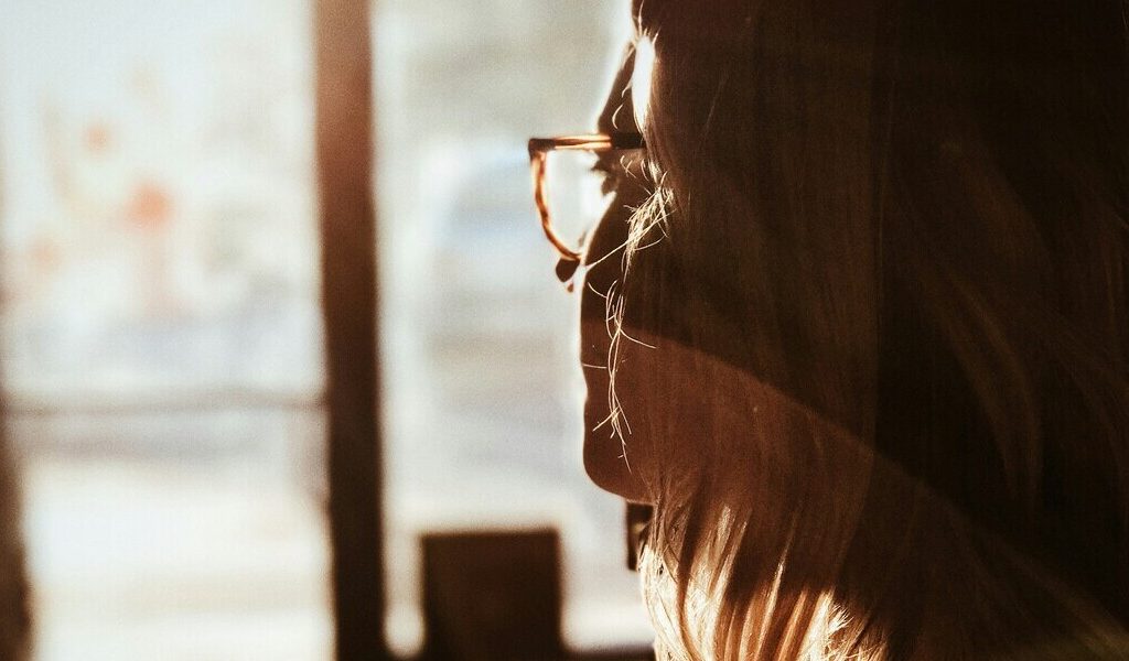 woman window 240212 unsplash